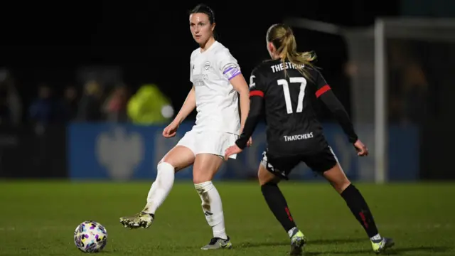 Lotte Wubben-Moy of Arsenal passes the ball whilst under pressure from Amalie Thestrup of Bristol City (obscured) during The Adobe Women's FA Cup Fourth Round match between Arsenal and Bristol City