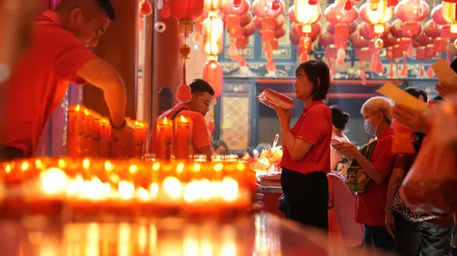 Worshipper in Bangkok's Mongkon Kamalwat temple