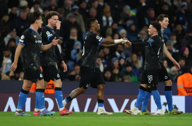 Club Brugge's Raphael Onyedika celebrates scoring their first goal with teammates