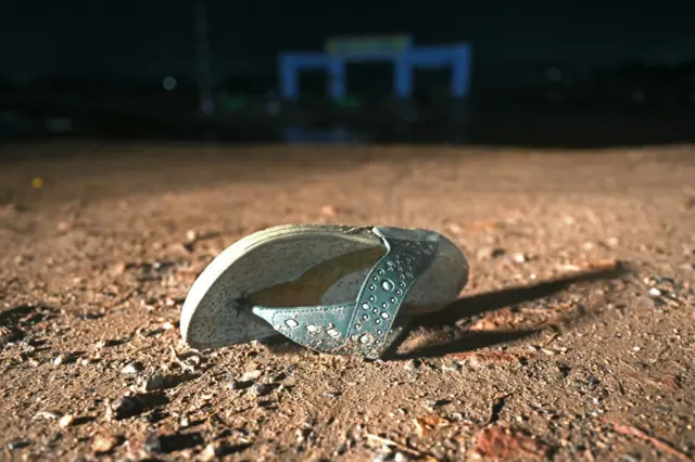 A sandal is pictured where a stampede killed at least 116 people during a Hindu religious gathering in Hathras, Uttar Pradesh state, India on July 3, 2024.