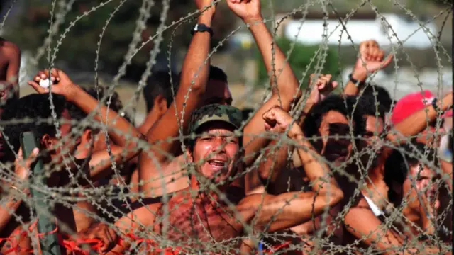 Migrants have been detained at Guantanamo Bay for decades, including this group seen at the base in 1994