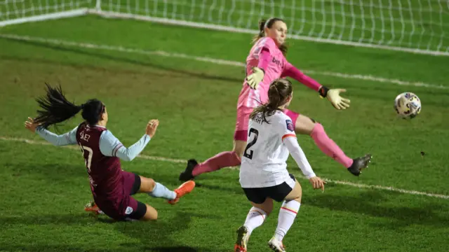 Lucy Parry of Liverpool scores her team's fourth goal as Megan Walsh of West Ham United fails to make a save during The Adobe Women's FA Cup Fourth Round match between West Ham United and Liverpool