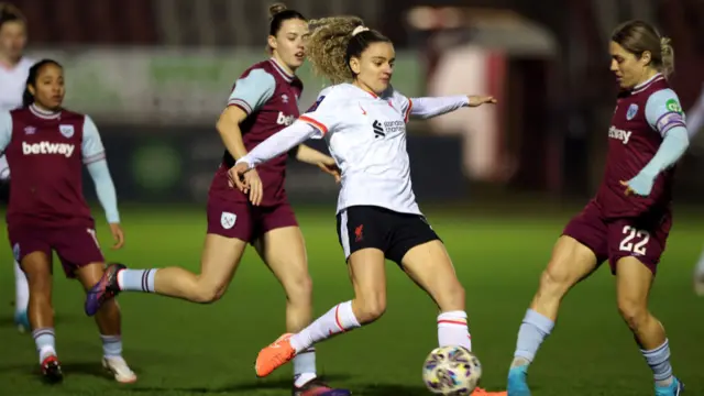 Leanne Kiernan of Liverpool is challenged by Katrina Gorry of West Ham United during The Adobe Women's FA Cup Fourth Round match between West Ham United and Liverpool