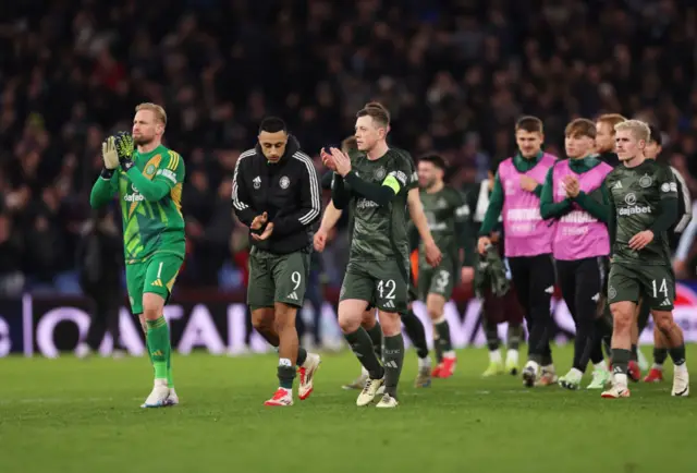 Celtic players applaud their fans