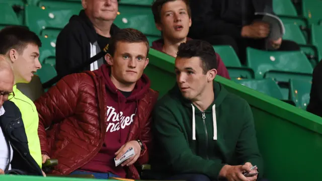 Hibernian's Liam Henderson (left) and team-mate John McGinn await kick-off at Celtic Park.