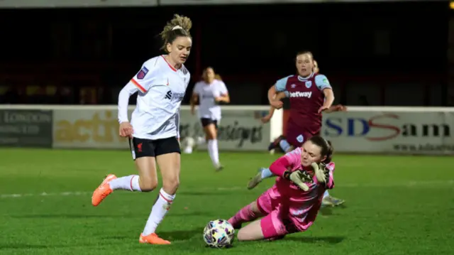 Leanne Kiernan of Liverpool rounds West Ham United goalkeeper Megan Walsh to score her team's second goal during The Adobe Women's FA Cup Fourth Round match between West Ham United and Liverpool