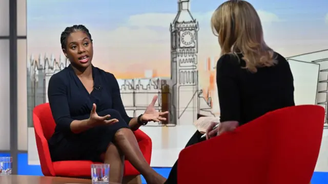 Conservative leader Kemi Badenoch speaks to Laura Kuenssberg. They are both sitting in red chairs.