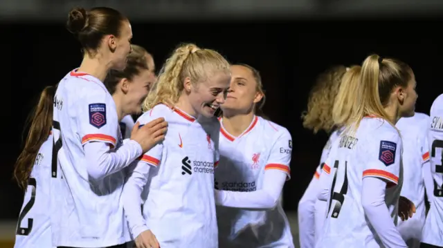 Grace Fisk of Liverpool celebrates scoring her team's third goal with teammates during The Adobe Women's FA Cup Fourth Round match between West Ham United and Liverpool