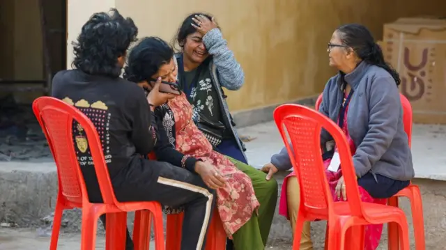 Relatives react outside a hospital mortuary following a stampede that occurred before the second "Shahi Snan" (royal bath), at the "Maha Kumbh Mela".