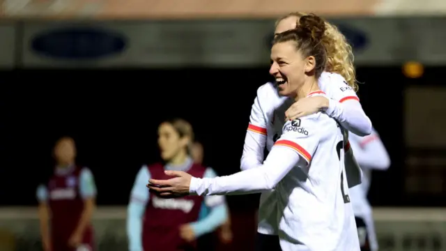 Yana Daniels of Liverpool celebrates with teammates after Camila Saez of West Ham United (not pictured) concedes an own goal, resulting in the first goal for Liverpool, during The Adobe Women's FA Cup Fourth Round match between West Ham United and Liverpool