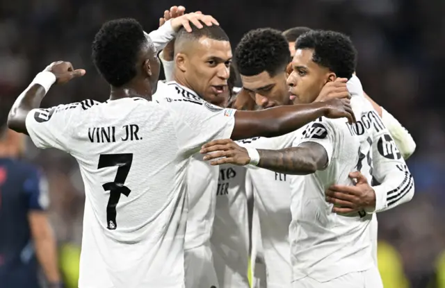 Real Madrid players celebrate a goal