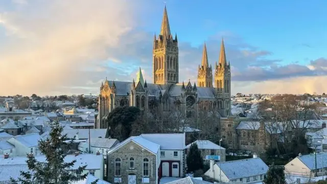 Truro, Cornwall, where snow covers roofs of houses and the church in January 2014