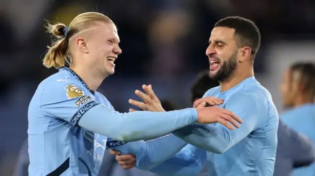 Erling Haaland and Kyle Walker after Man City's victory against Leicester