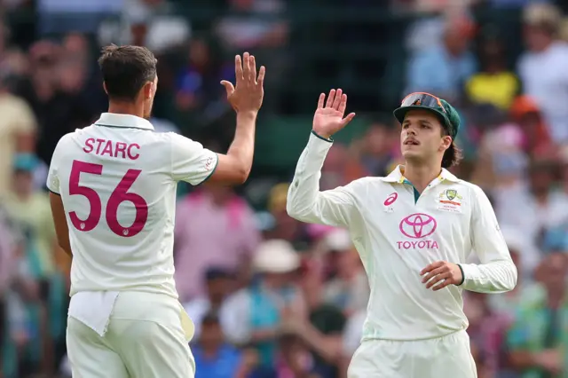 Sam Konstas and Mitchell Starc celebrate wicket