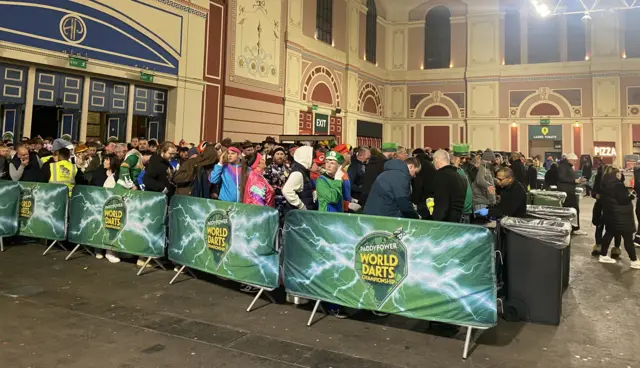 Fans queue to get into Ally Pally for PDC final