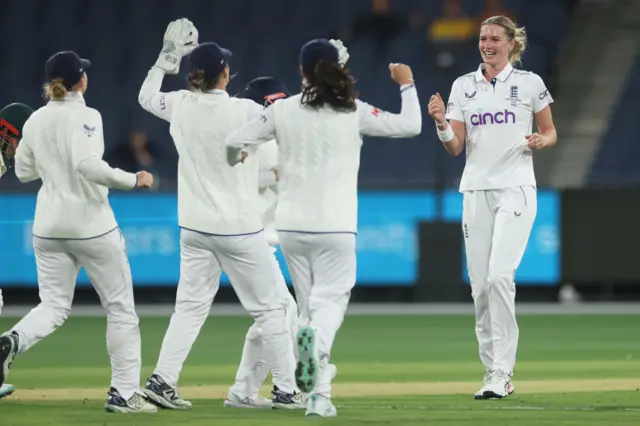 Lauren Bell celebrates her wicket