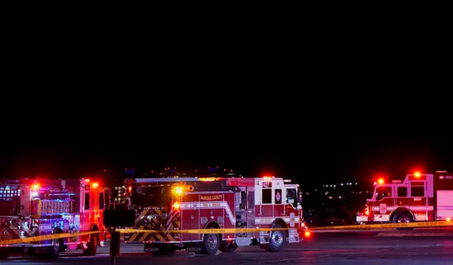 Emergency services operate at Gravelly Point, after American Eagle flight 5342 collided with a helicopter while approaching Reagan Washington National Airpor