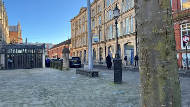 The Reverend waits in the street outside the venue