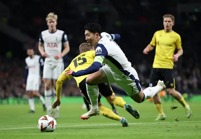 Son Heung-Min of Tottenham Hotspur is challenged by Simon Hedlund