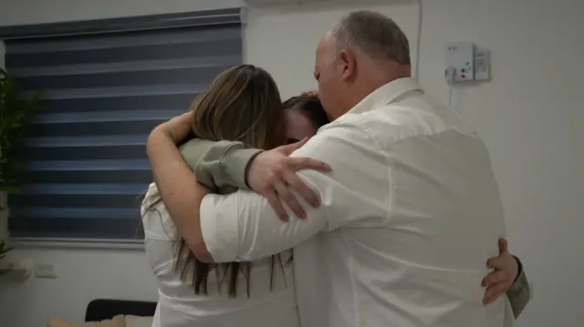 Agam Berger and her parents