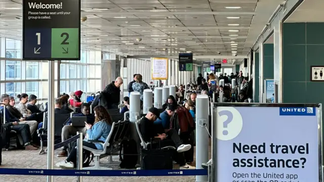 The airport interior looking normal with people