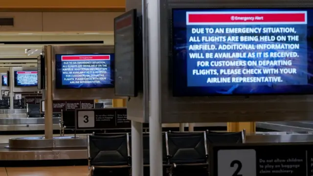 Signs inside Reagan Washington National Airport show information reporting the incident near the airport