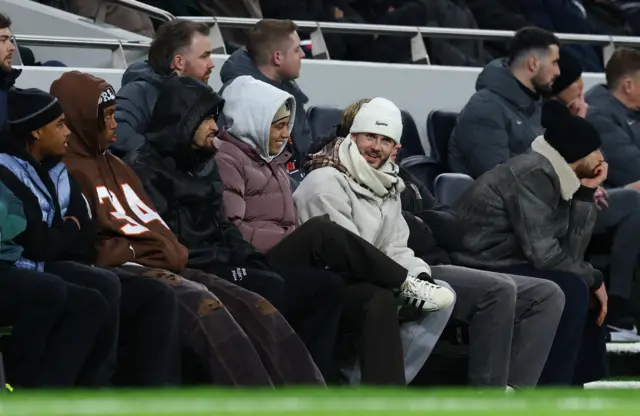 Spurs injured players sit on the bench