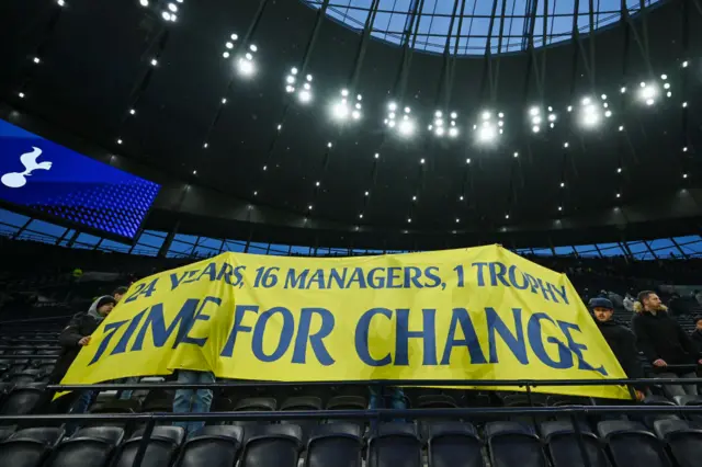 Spurs fans hold a banner up in protest against Daniel Levy