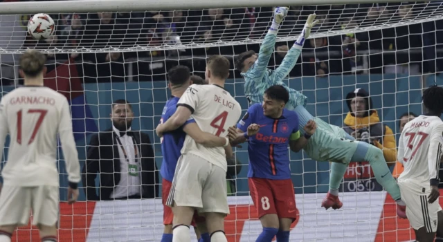 FCSB's goalkeeper Stefan Tarnovanu (2-R) in action