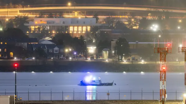A photo from earlier this morning shows a Police boat guarding the crash site on the Potomac River