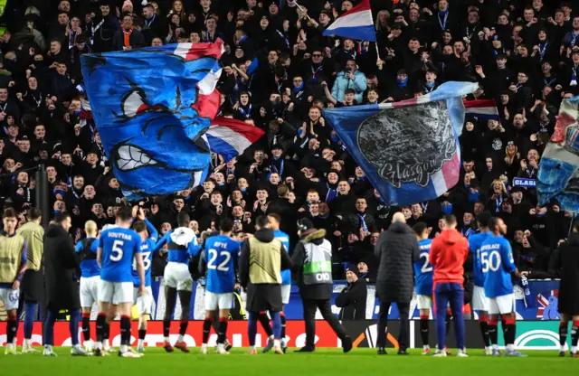 Rangers fans celebrate with the players