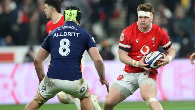 Evan Lloyd carries the ball for Wales