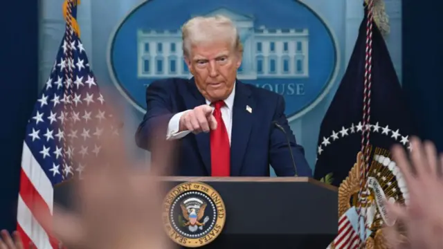 Donald Trump points at press conference