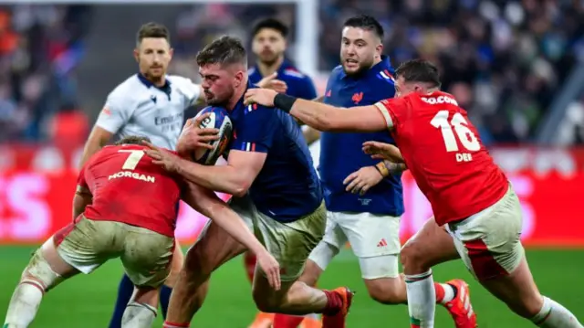 Gregory Alldritt of France is tackled by Jac Morgan of Wales