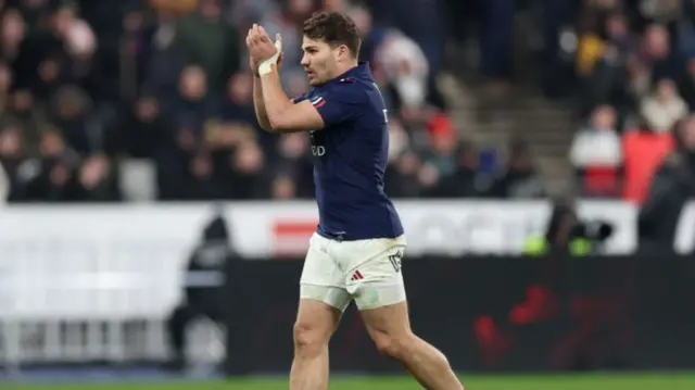 Antoine Dupont of France applauds the fans as he leaves the field after being substituted