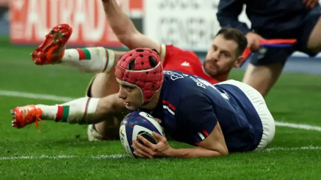 Louis Bielle-Biarrey dives over the line to score France's fourth try