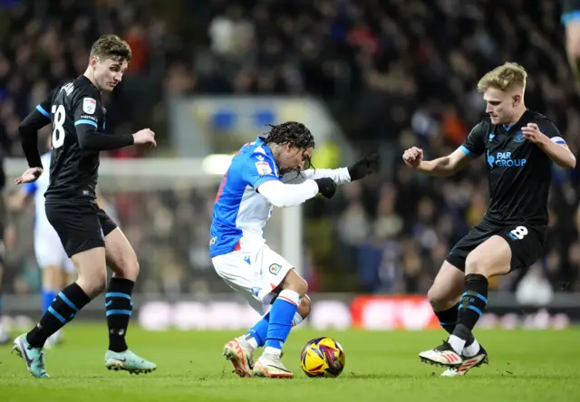 Blackburn Rovers' Tyrhys Dolan (centre) and Preston North End's Ali McCann (right) battle for the ball