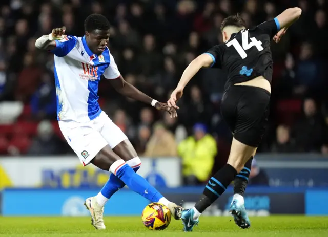 Blackburn Rovers' Makhtar Gueye (left) and Preston North End's Jordan Storey battle for the ball