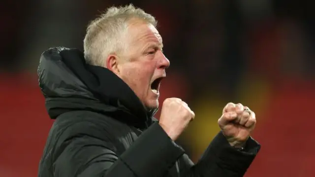 Sheffield United manager Chris Wilder celebrates in front of the travelling support at Vicarage Road