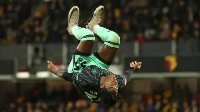 Sheffield United goalscorer Andre Brooks produces a somersault celebration after finding the target at Watford