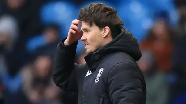 Sheffield Wednesday manager Danny Rohl scratches his head