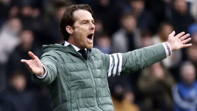 Burnley manager Scott Parker has his arms outstretched during the 1-0 win over Blackburn