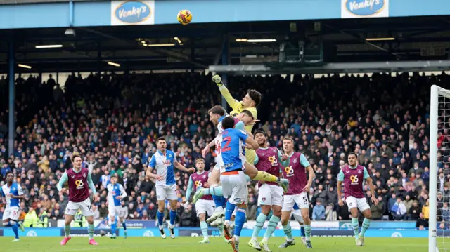 Burnley goalkeeper James Trafford punches clear