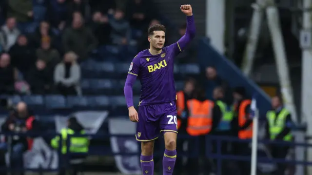 Oxford goalscorer Ruben Rodrigues raises his fist in celebration