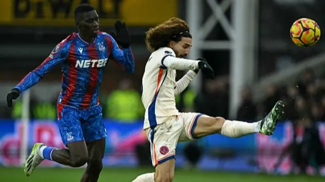 Marc Cucurella (R) clears under pressure