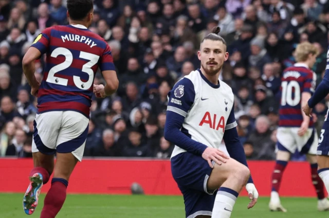 Tottenham Hotspur's Radu Dragusin looks dejected after Newcastle United's Alexander Isak scores