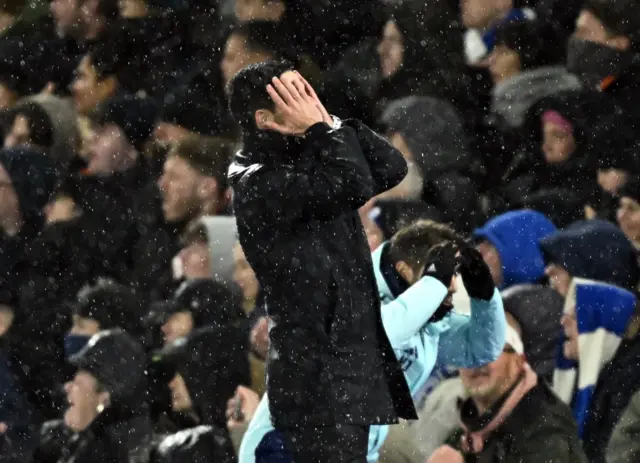 Arteta covers his face with his hands after a missed chance