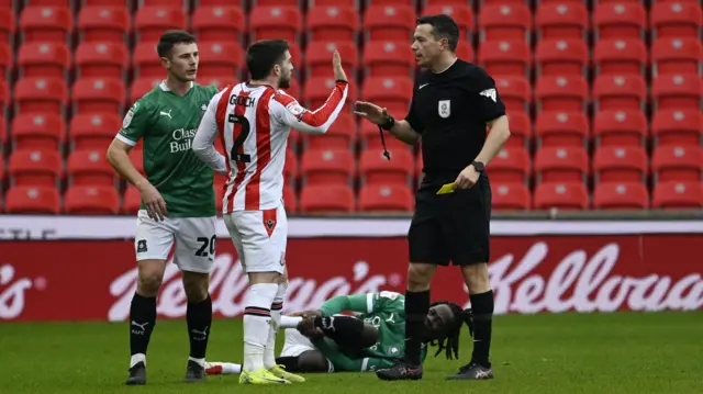 Stoke defender Lynden Gooch is booked