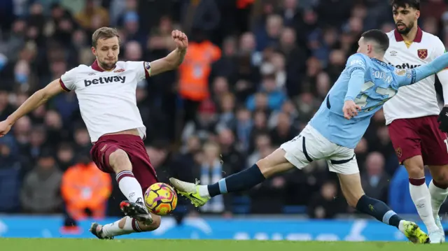 West Ham United's Tomas Soucek in action with Manchester City's Phil Foden