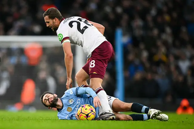 Bernardo Silva (down) is fouled by West Ham United's Tomas Soucek